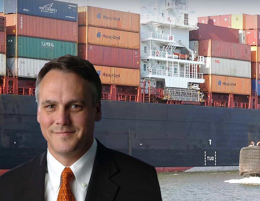 Business-Valuations-Expert-DM-Buck-in-front-of-container-ship